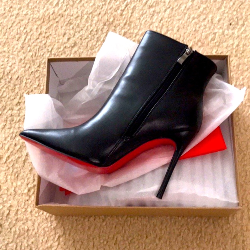 Black boots with red bottoms